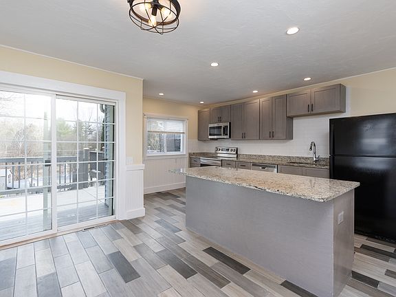 Kitchen with Center Island, leading out to Semi-Private Deck