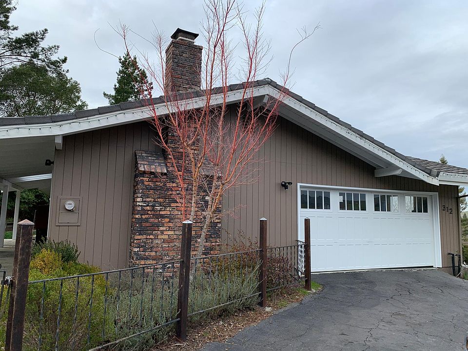 Exterior of home was recently repainted and a new garage door installed