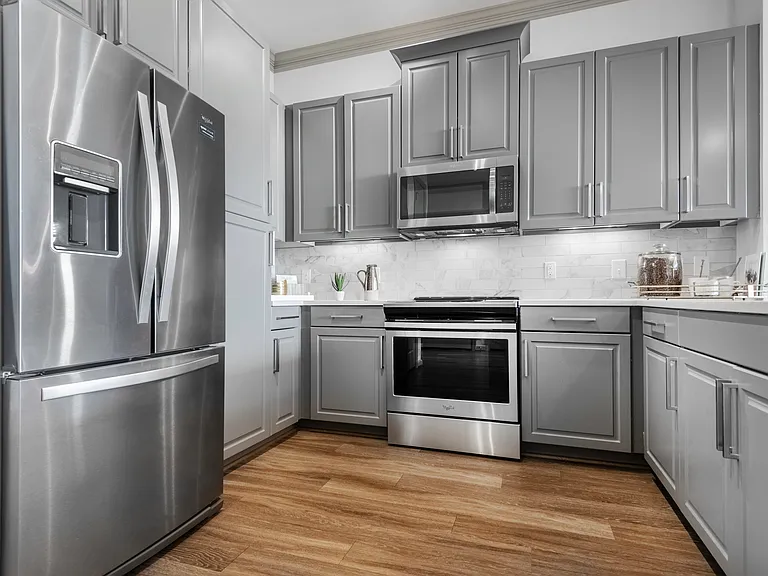 Stylish Kitchen with Modern Finishes at The Hendry Apartments