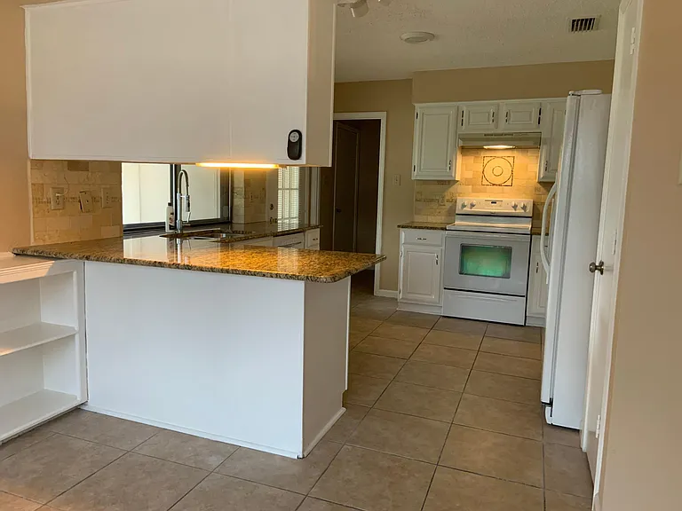 Breakfast area with kitchen in the background
