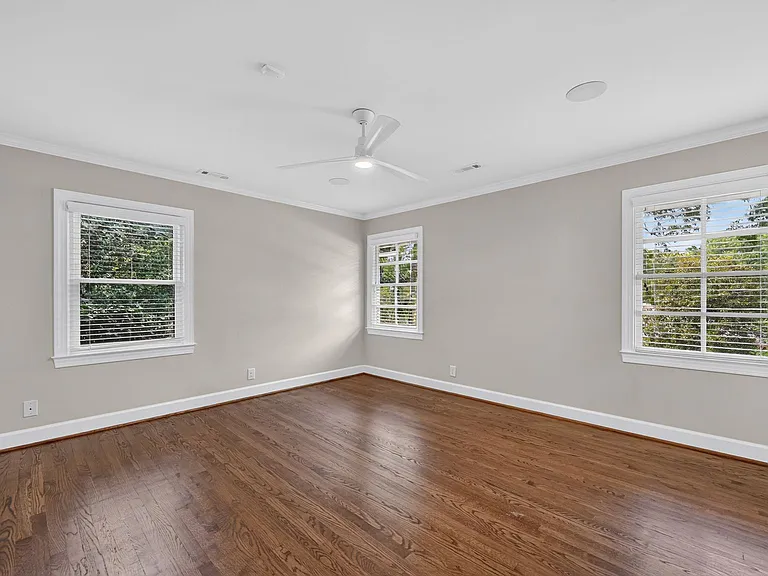 Second view of master bedroom bathed in sunlight - or easily darkened with blinds (curtain rods and curtains may be added.)