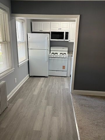 Kitchen View with Refrigerator, Gas Range and Micro-wave