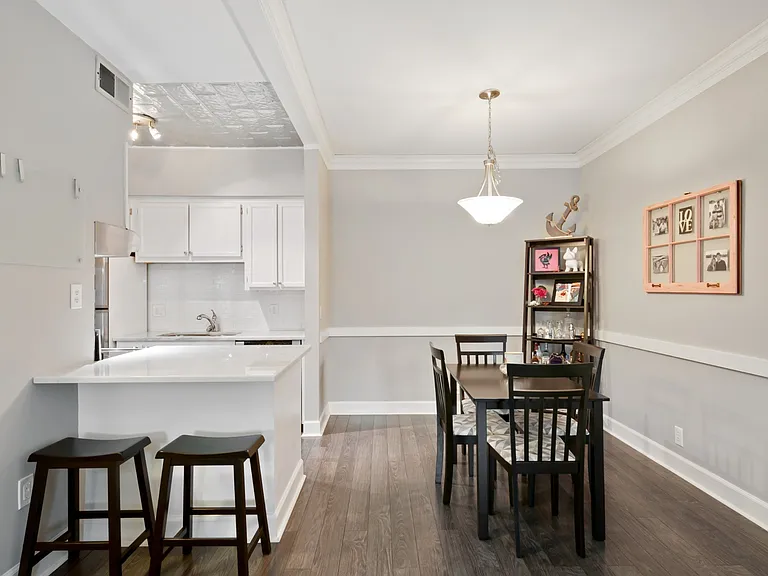 Open dining area with breakfast bar and direct flow into the kitchen.