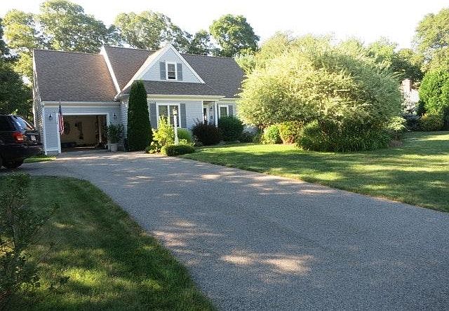 Front of House With Parking In the Garage and on the Left of Drive Way