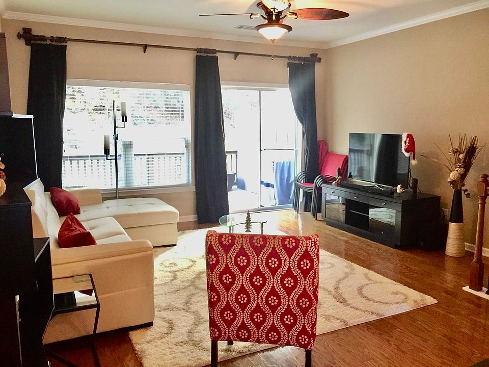 Sun-filled living room overlooking a private patio