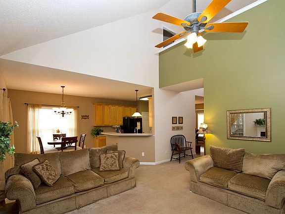 An open plan w/ vaulted family room creates a spacious feel & grand impression