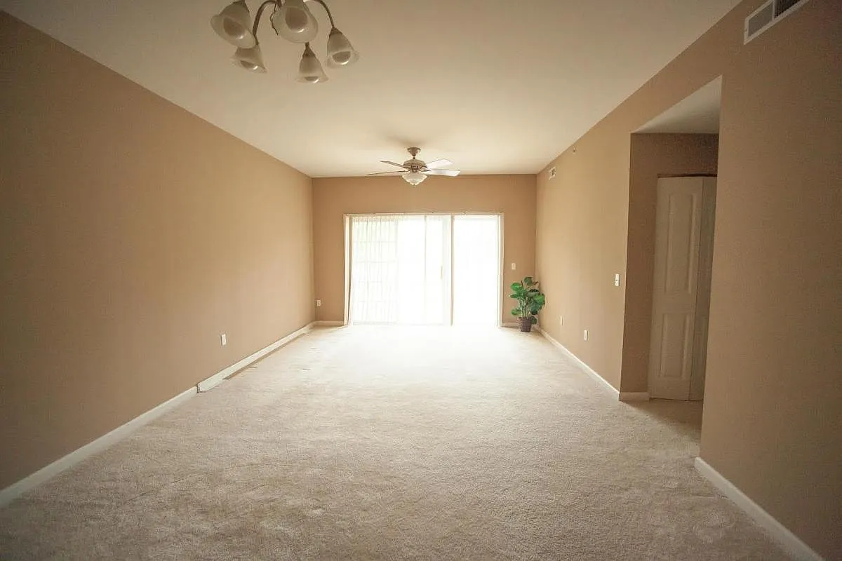 Living Room with door to private patio - 121 Saint James Ct
