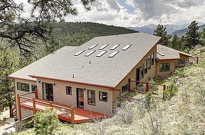 East side of the house.   Far left windows is the work studio.