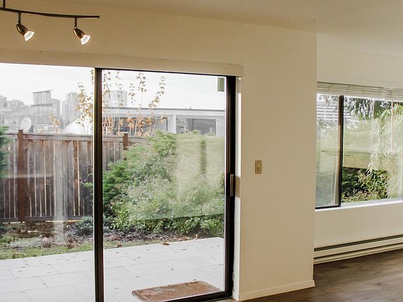 Patio access with open floor plan from Dining space to Living Room.