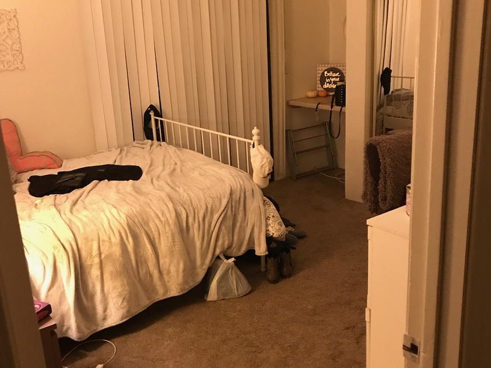 big cozy room with built in desk and tall ceilings.