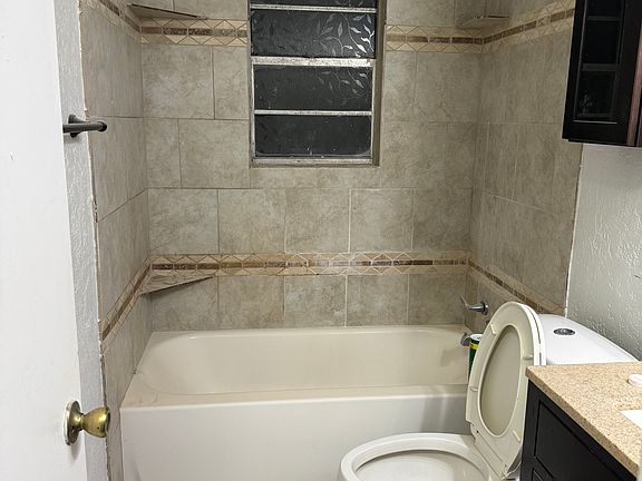 Full path with one touch flush toilet and granite countertops