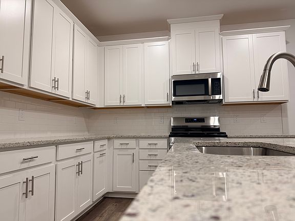 Tons of cabinet space and counter-top space in this beautiful kitchen. Large pantry, too!