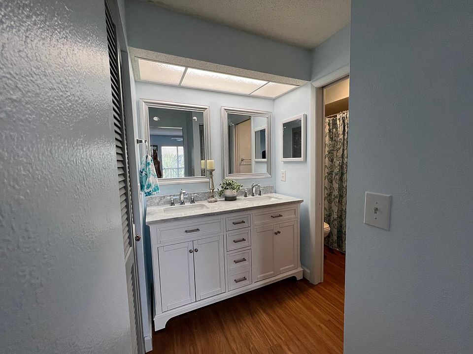 Twin master bedroom sinks with designer vanity and new faucets