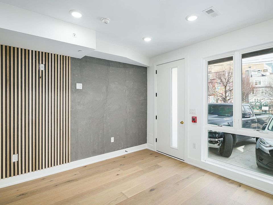 Spacious living room with modern accent wall.