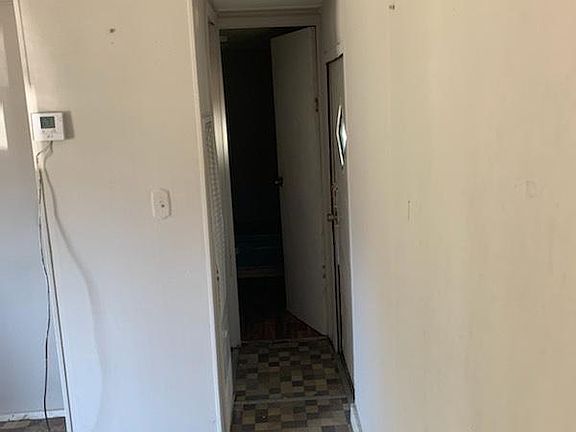 Hallway leading to the bathroom and bonus room.
