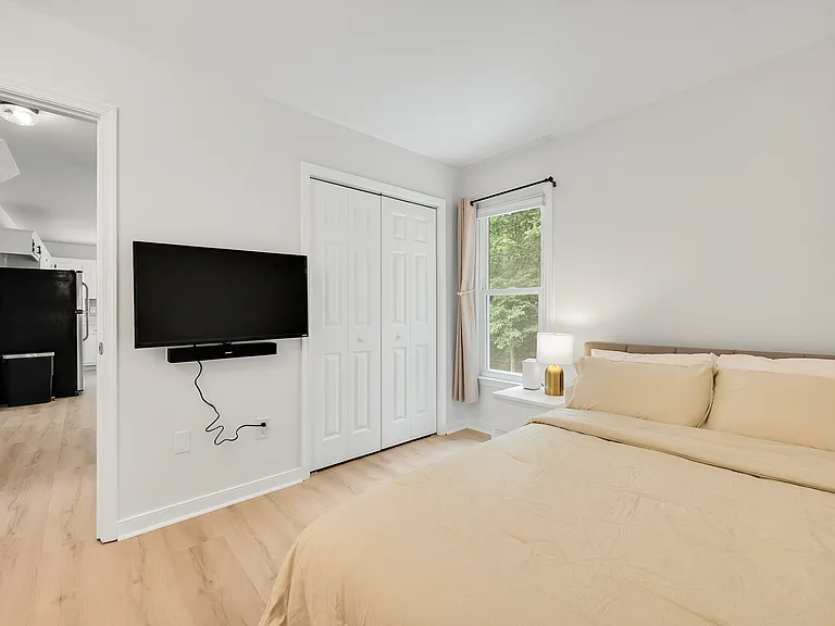 Bedroom 1, on 1st floor. Queen bed, with 100% organic cotton, breathable, OEKO-TEX_ certified sheets. Blackout curtains.