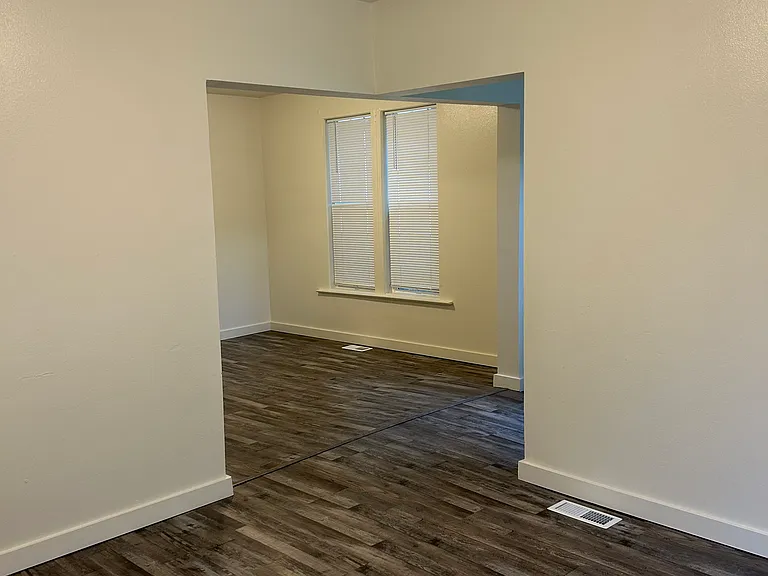 In Living room with dining room in back