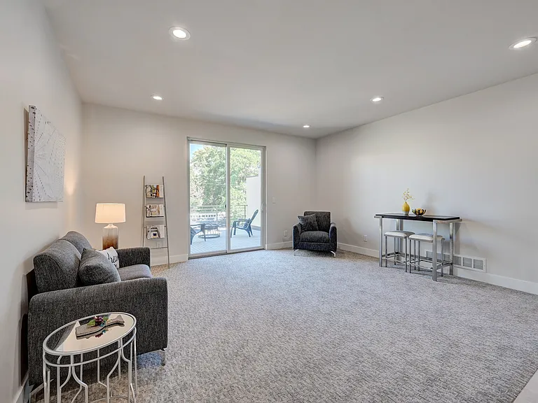 Third Floor Entertainment Room With Wet Bar and Refrigerator