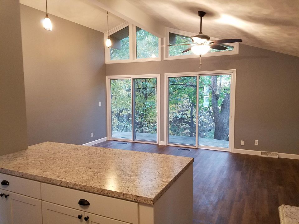 kitchen, dining, and living room with cathedral ceilings.