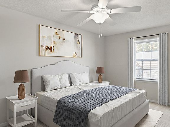 Experience relaxation in this elegantly designed bedroom, complete with modern amenities.