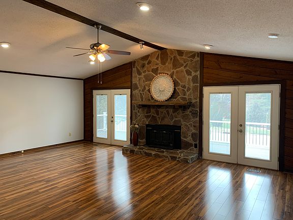 Family Room with Vaulted Ceilings Open to Kitchen, Dining Area, and Deck--great for entertaining
