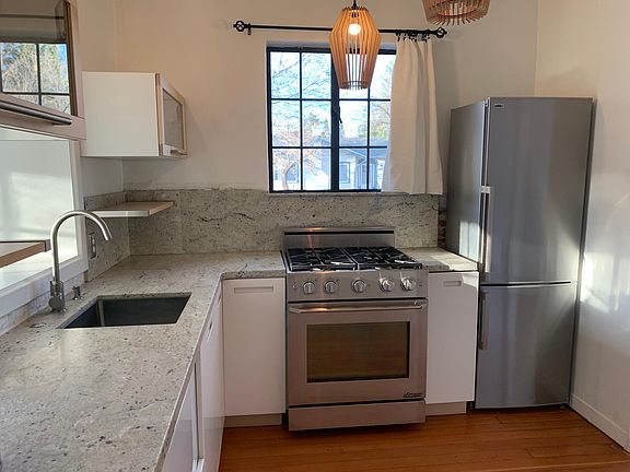 Dacor professional gas range, euro cabinets and stone counters