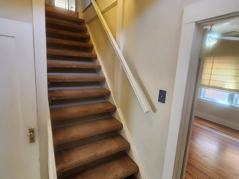 Stairs to upper level 2 bedrooms and 2nd bath