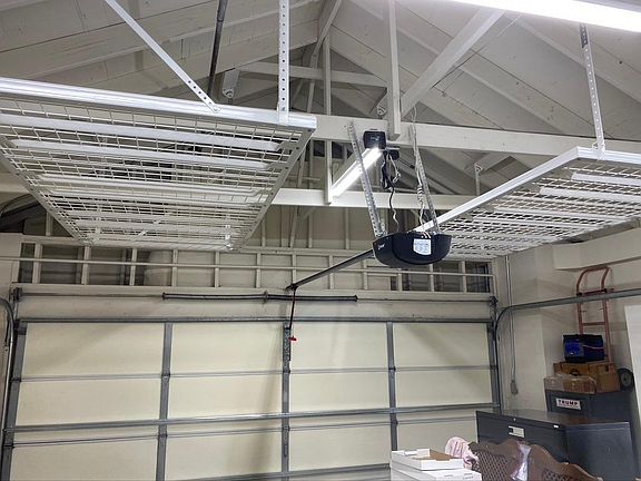 2 Overhead metal storage racks + New Garage Door Opener w/ Battery back-up
