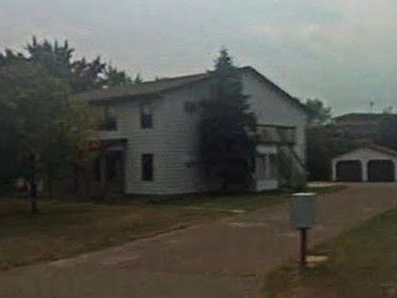 Side, parking and garage in back, unit is second floor
