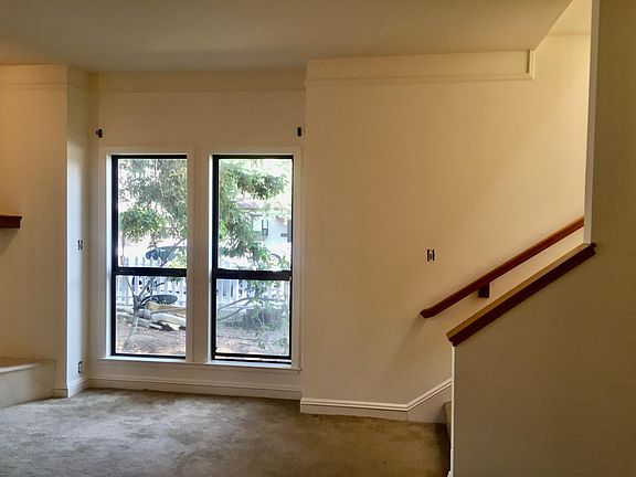 Living room with sky-lit stairs