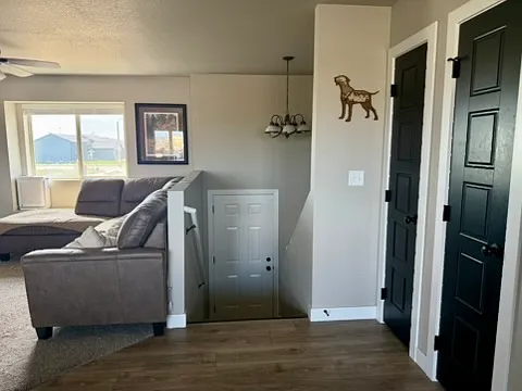 Staircase from the kitchen, view to the front of the home.