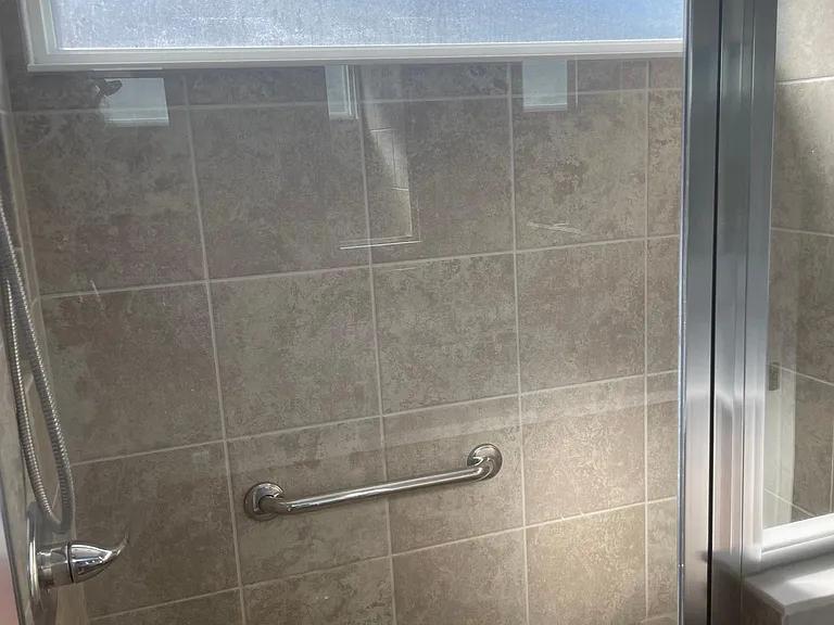 Tiled shower. No enclosures