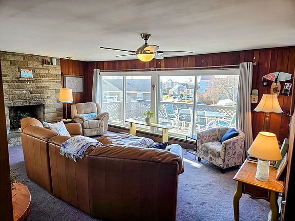 Sun filled upstairs living room, deck