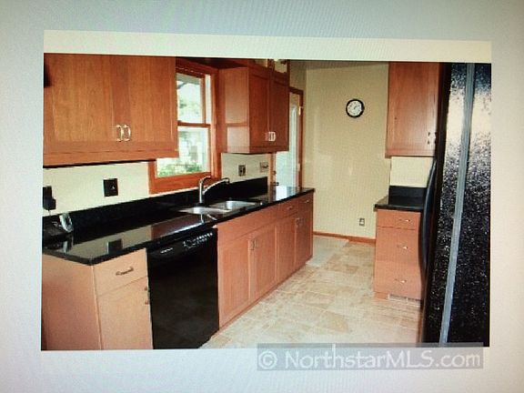 Kitchen, cherry cabinets, tile floor, dishwasher, gas stove,