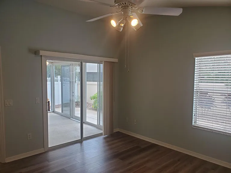 Master bedroom has private access to the Lanai and nice views of the backyard