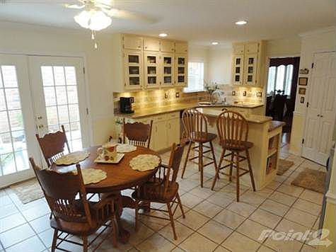 Granite counter tops w/ tile backsplash, & glass upper cabinets!