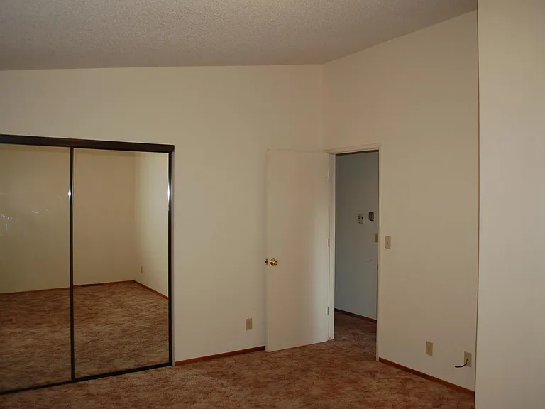 Mirrored wardrobe doors in bedrooms and valted cealings. High efficiency Mini split AC in bedroom!
