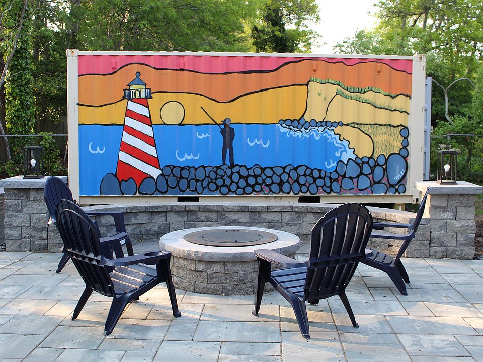 Large stone patio with build in firepit and seating