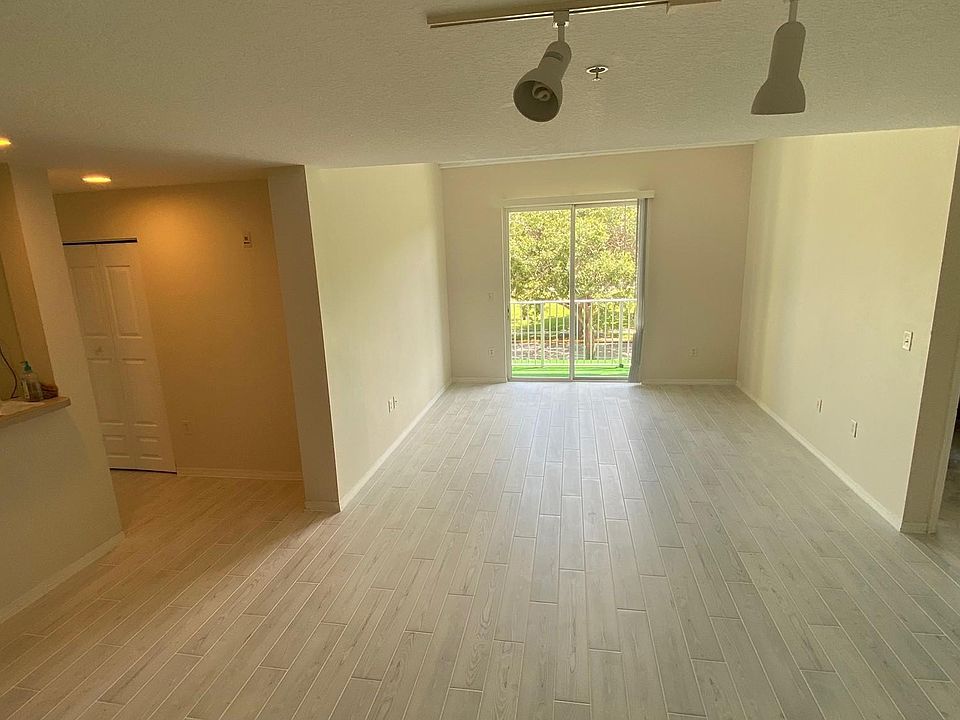 Living/Dining Area with high Ceiling and New Tile Flooring