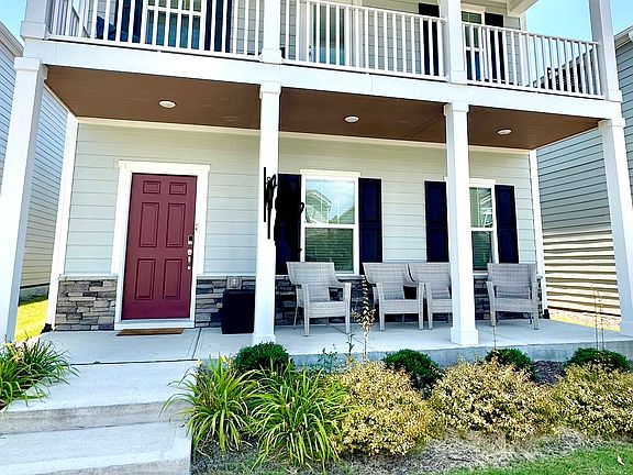 Front of house has lovely deck off primary bedroom and front porch for morning and evening enjoyment