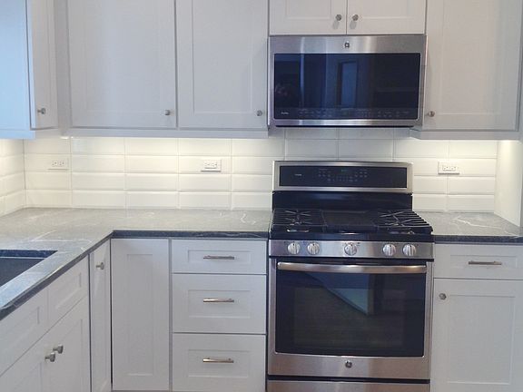 G.E. gas range w griddle and 30" microwave