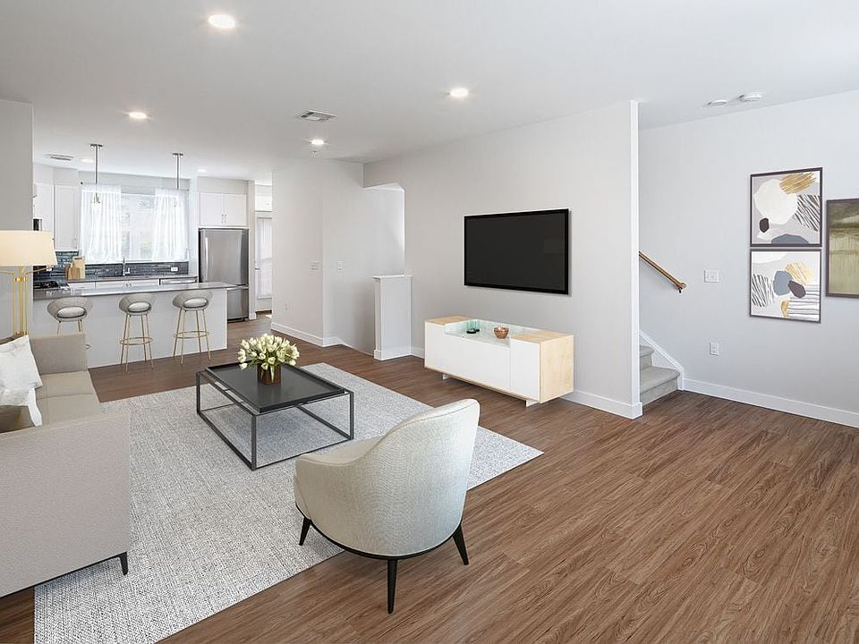 Phase II Renovated Package I townhome living and dining area with hard surface flooring