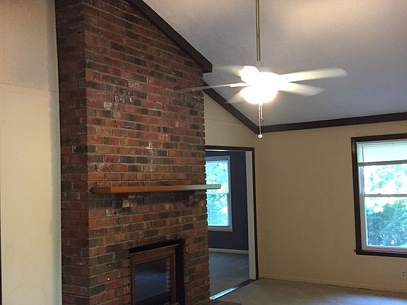 Den w/ volume ceiling and skylight