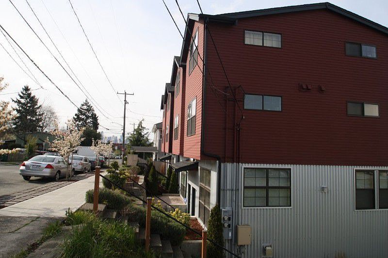 This view shows front corner of this home. To the left you can see downtown.