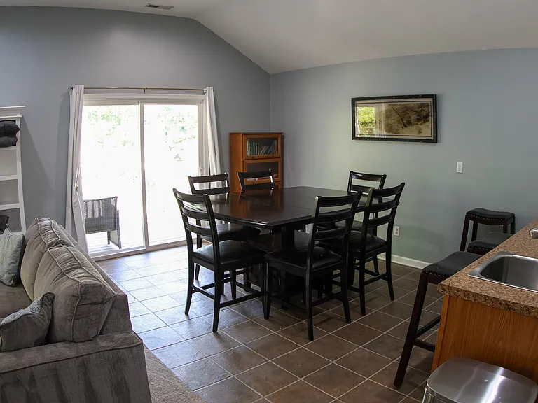 2nd floor dining and living room with kitchenette and access to the 2nd floor balcony.