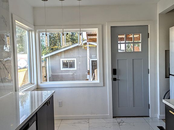 Kitchen & Door to the Back yard and Garage