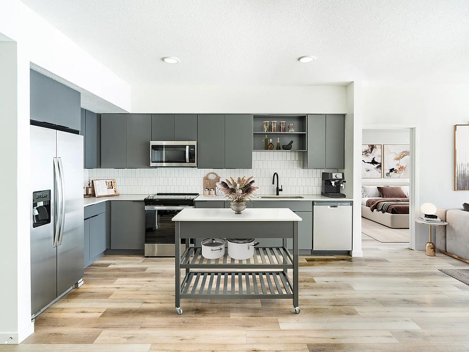 A refined kitchen paired with a movable island, bringing flexible style and function to everyday living at Modera Encore in Tampa.