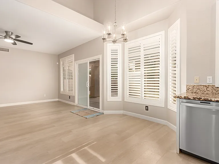 Family Room Connected to the Kitchen with Sliding Glass Doors Leading to the Backyard.