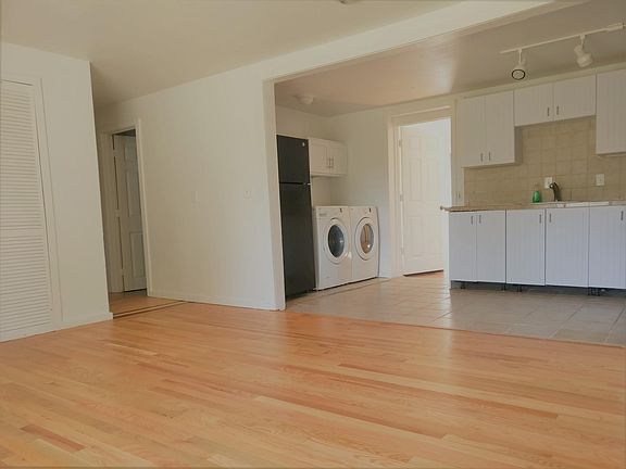 Open concept floor plan. Living room opens up to kitchen