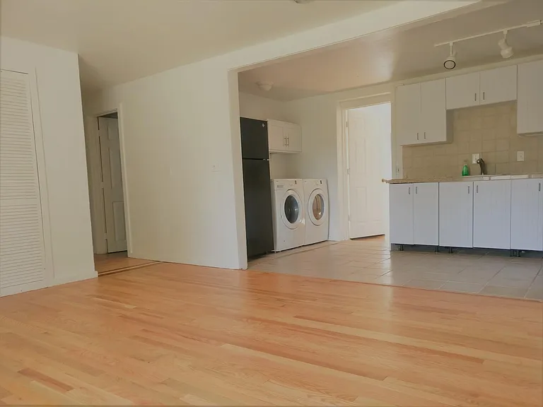 Open concept floor plan. Living room opens up to kitchen